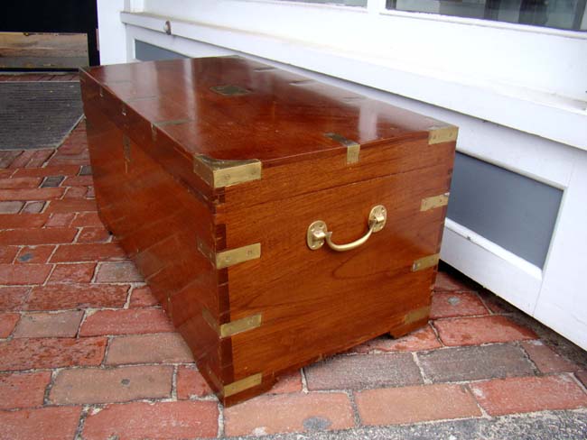 A n attractive late 19th century brass bound teakwood chest